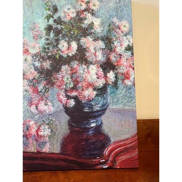 Canvas reproduction of Claude Monet’s Chrysanthemums, originally painted in 1897. Printed on canvas for added texture and...