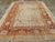An antique Turkish Oushak room size carpet. This western Anatolian workshop carpet is patterned in a derivative Persian...