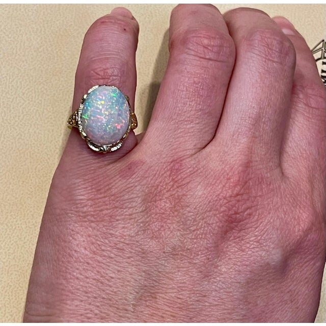 9 Carat Oval Shape Ethiopian Opal Cocktail Ring 14 Karat Yellow Gold For Sale In New York - Image 6 of 18