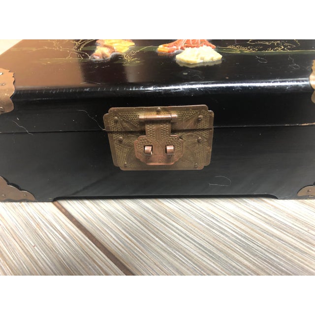 Mid Century Asian black lacquer jewelry box. This jewelry box was made in Singapore label shown in picture. Has a relief...