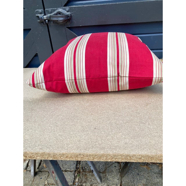 A newly crafted pillow made from a circa 1900 red and white cotton stripe ticking, a down insert is included