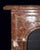 Striking c. 1870's French provincial style marble fireplace mantel in a beautifully veined red marble. Spandrel panels...