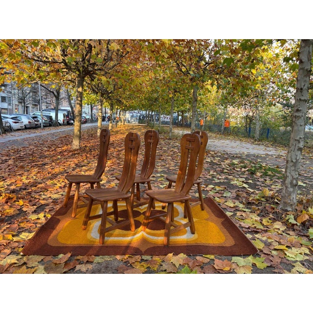Rare and beautiful Brutalist high-back chairs in solid oak by De Puydt, a Belgian furniture maker from the 1960s. These De...