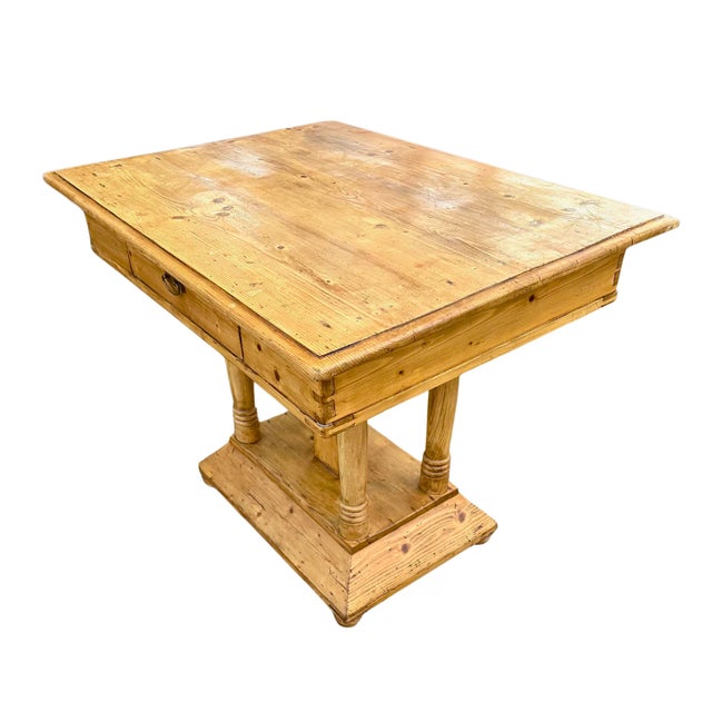 Beautiful antique white pine parlor table from 19th century England. Boasts original dovetail joint construction, bun...