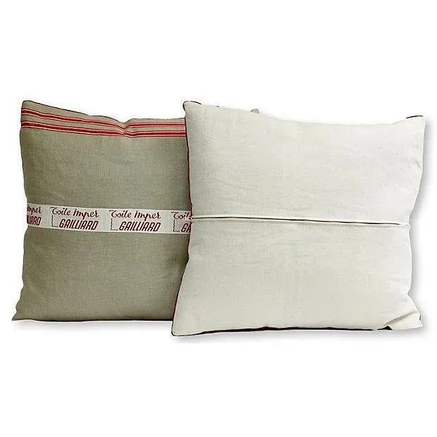 Pair of hand-made pillows, using vintage French linen and ribbon. The ribbon is from a midcentury tailoring shop in...