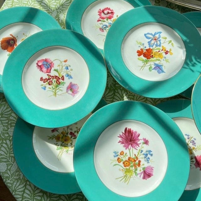 This is an absolutely stunning and RARE set of 9 hand-painted dinner plates in a gorgeous array of floral / botanical...