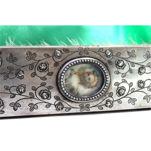 Silver Brush with Raised Floral Motifs, in Very Good conditions. Designed 1920 to 1949 This piece has an attribution mark,...