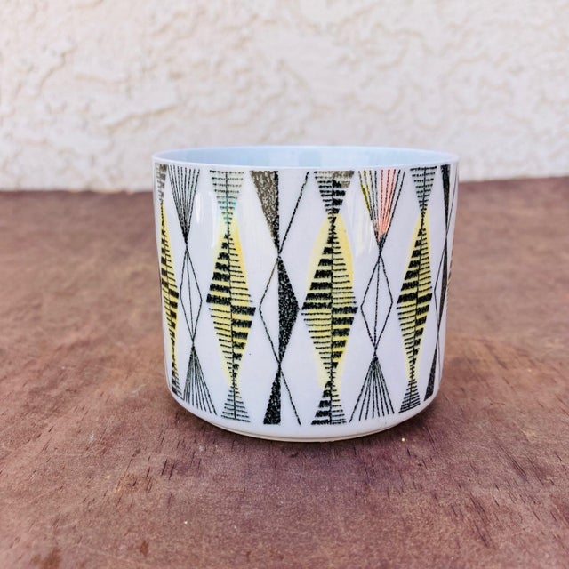 This is a most delightful 1950s ceramic Rorstrand "Curtis" Cup. It features a multi-color geometric lined pattern on a...