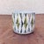 This is a most delightful 1950s ceramic Rorstrand "Curtis" Cup. It features a multi-color geometric lined pattern on a...