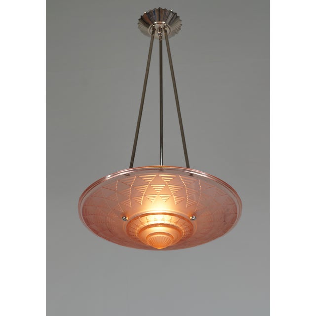 Hubert Petitot A stunning French 1935 art deco chandelier in nickel plated solid brass by Hubert Petitot holding a...
