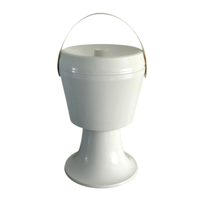 Vintage 1960’s space age ice bucket. Solid white ice bucket with handle. The ice bucket removes into pieces as well. The...