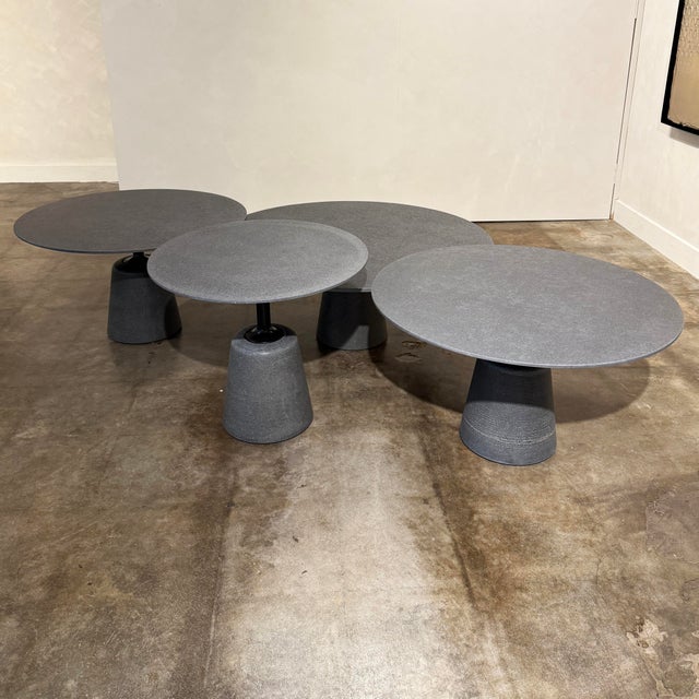 Set of Four Rock Mini Side Tables by MDF Italia with anthracite cement tops and bases. Small Table Diameter: 23 5/8”...