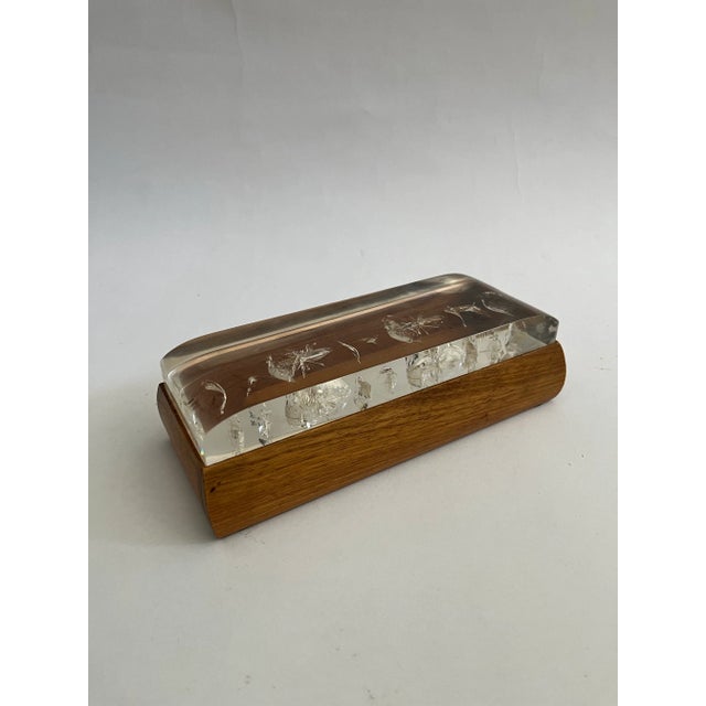 This is a beautiful wooden box with a resin lid with a star-like design. The storage compartment is open, perfect for...