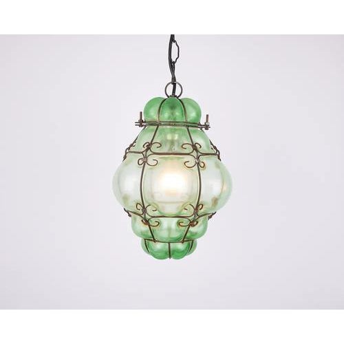 Discover timeless elegance with our rare 1960s matte green venetian murano caged glass pendant light. This exquisite...
