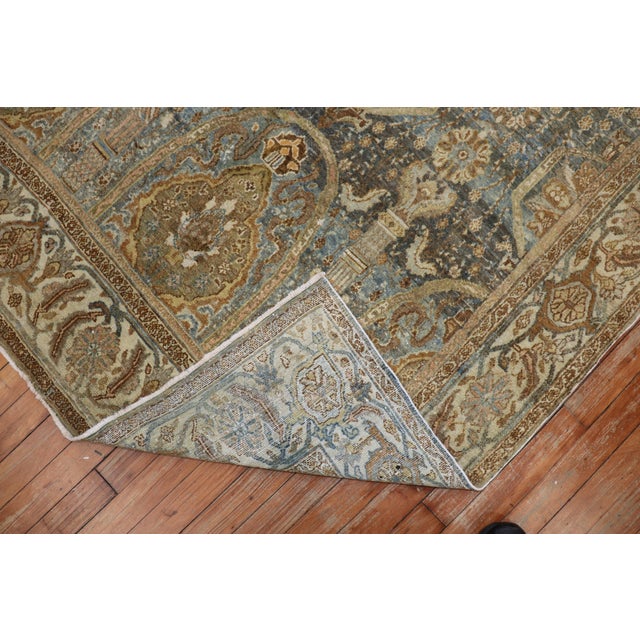An appealing early 20th century Persian Senneh city weave rug with a captivating large-scale design in green and brown....