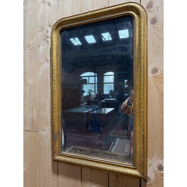 A Louis-Philippe period mantel mirror, second quarter of the 19th century, entirely original. Vertical, vertical format...
