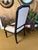 This handsome arm chair would be perfect at a desk, a table, or as an accent in any space. Wood frame finished in an ebony...