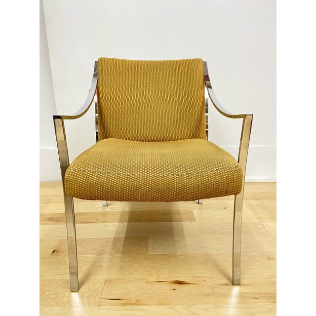 Vintage chrome frame arm chair in the style of Milo Baughman circa 1960s. Features satin chrome frame in a solid weld with...