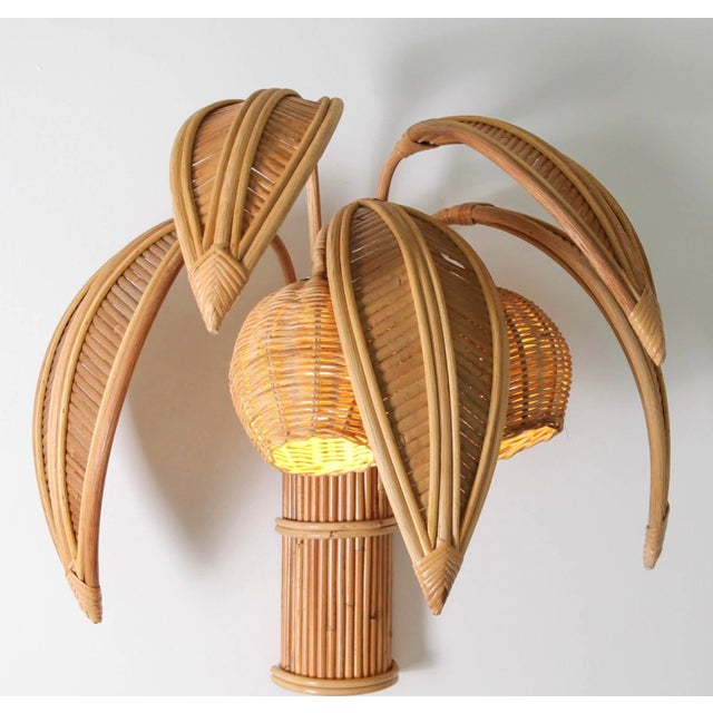 Superb pair of rattan wall sconces depicting coconut palms, each composed of five removable fronds (convenient for...