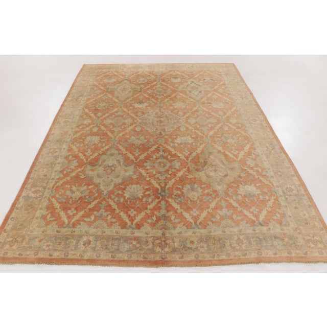 This antique 8x11 hooked rug is handmade in wool and originates circa 1920–1929. It features an elegant medallion floral...