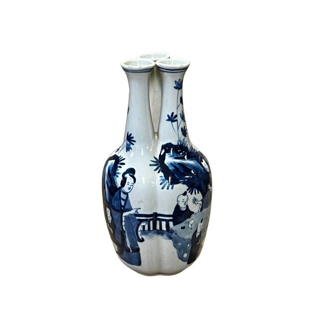 This is a Chinese decorative porcelain vase display in a Blue and White color finish. The theme is an oriental family...