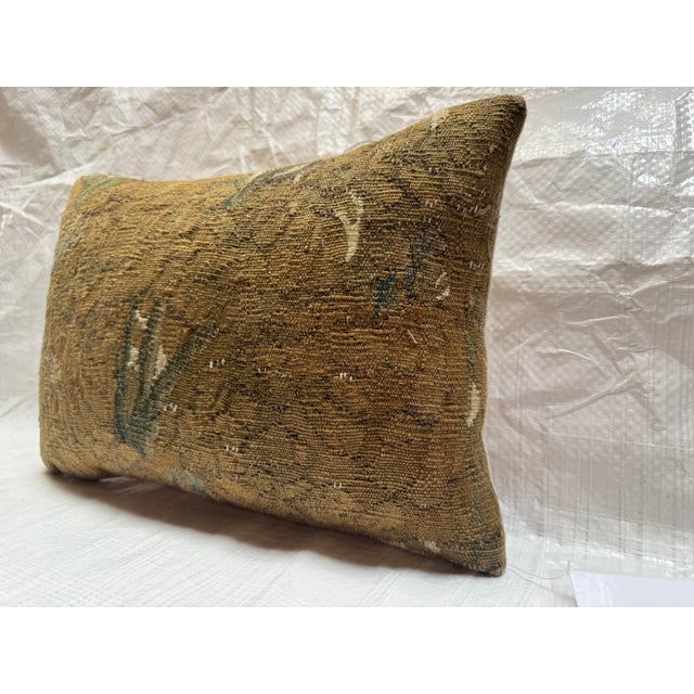 Made from a genuine 17th century Brussels tapestry fragment, this pillow embodies the rich textile heritage of Flemish...