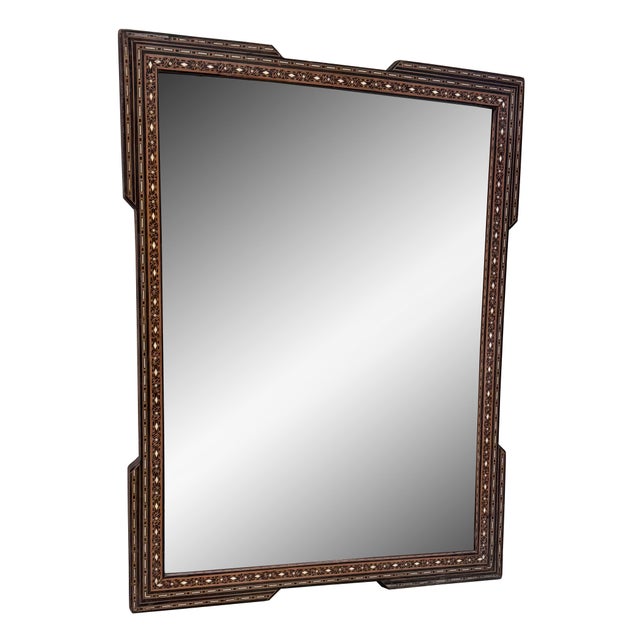 An exquisite early 20th century Syrian mirror showcasing traditional mosaic inlay craftsmanship. The wooden frame is...