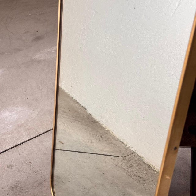 This exclusive shield-shaped mirror, attributed to the iconic Gio Ponti, epitomizes mid-century Italian design. Crafted in...