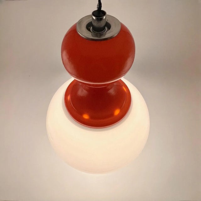 Explore the charm of the Sixties with this exquisite vintage 60s lamp, made in Italy. This striking piece features a...