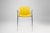 Belgium / 2000 / chair / plastic, metal / Mid-century / Design A sleek yellow chair with metal frame and arm rests,...