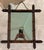 A charming antique French wall mirror featuring turned faux bamboo frame in darkened wood. The sculptural joinery mimics...