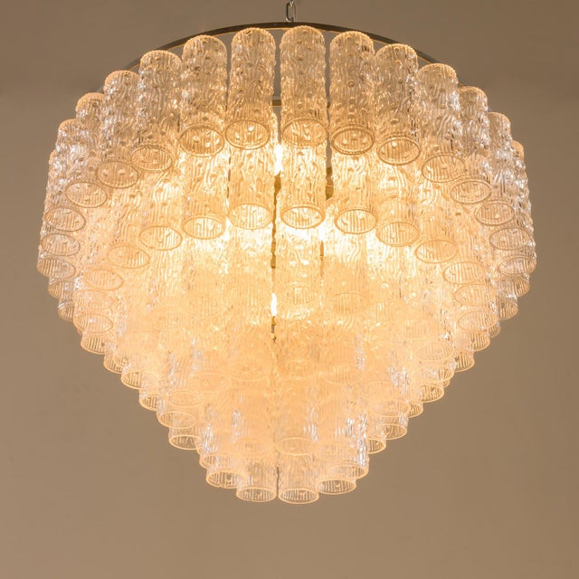 This vintage murano glass chandelier, based on the glass work, was made in the 1960s by the venini. The shades are the...