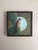 This oil painting features a Cactus Wren perched on a cactus, set against a softly illuminated moonlit background. The...