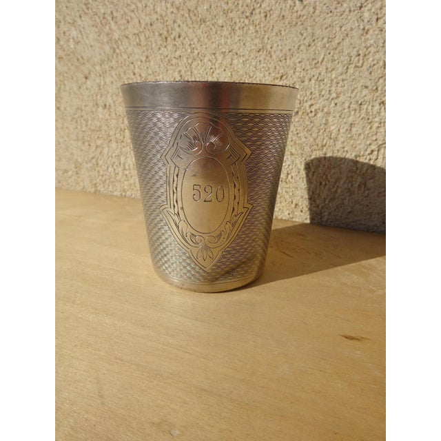 Silver-plated metal cup, a French-made christening gift by the silversmith Ercuis, late 19th century. Chased decoration...