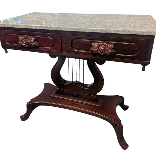 Vintage Victorian Lyre Base Foyer Console Table with Granite/Marble Top Description: Elevate your entryway or living space...