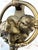 Gold-Tone Cast Metal Kissing Couple Door Knocker A charming sculptural door knocker featuring two facing profiles within a...
