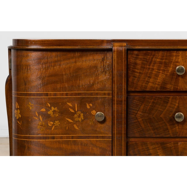 A refined French Art Deco commode, sourced in Paris and dating to the 1930s. Executed in richly figured walnut, the piece...