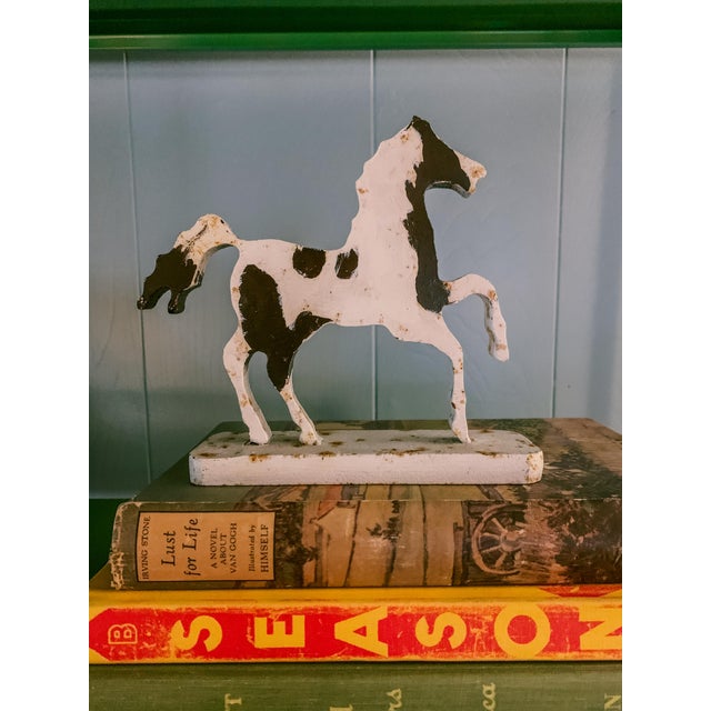 This unique vintage folk art style horse decorative sculpture is modern in line and graphic style while maintaining it's...
