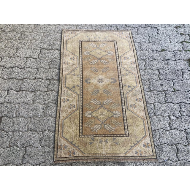 This is a vintage Turkish Oushak rug from the 1960s. The piece was hand-knotted.