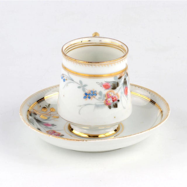 A couple of tea from the Kuznetsov plant in Volkhov. Nice, merchant item with painting, gilding, floral motif on fine...