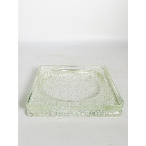 Glass ashtray, France, 1950s, with a simple and elegant design. Made of molded glass with a light green tint, it features...