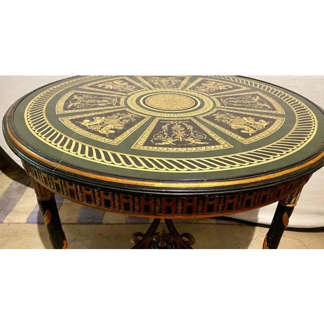 French neoclassical style center table with églomisé glass top of Architectural design. This one of a kind center, end or...