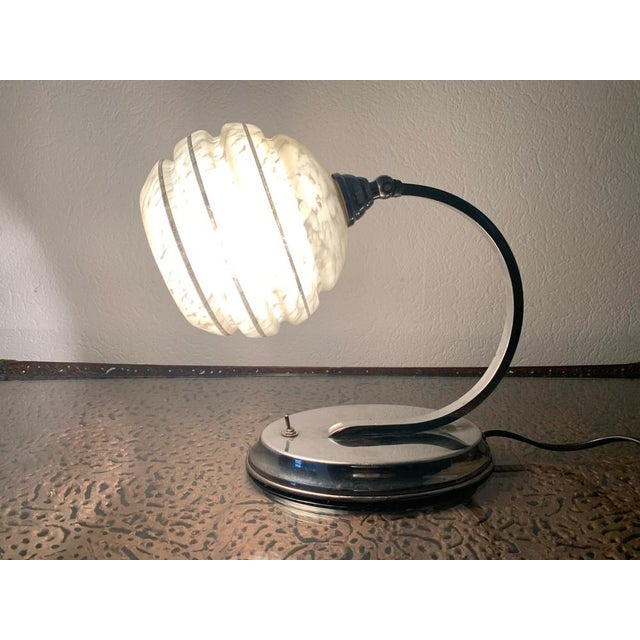Beautiful, vintage, bedside/table lamp from the Art Deco period, with an articulated, glass shade, and chrome-plated, oval...