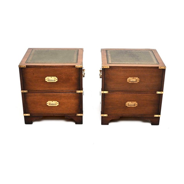 A wonderful pair of antique military campaign style bedside chests. They were made in England, and date from around the...