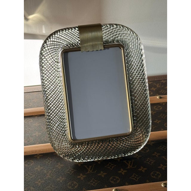 This magnificent vertical photo frame is purely in the tradition of Venetian glassmaking. The technique used to achieve...