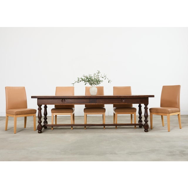 Imposing late 19th century country French provincial style farmhouse harvest dining table crafted from solid oak. The...