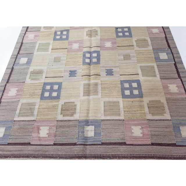 Vintage Swedish flat woven rug Size: 5'1" × 8'0" (154 × 243 cm) A mid-century vintage Swedish flat-weave rug, handwoven in...
