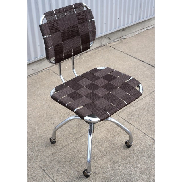 Extremely rare 1950s chrome office/desk chair on casters made by Bevco with brown woven polyurethane seat and back. There...
