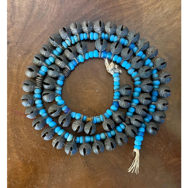 Metal Long Strand of Brass Bronze Bells Strung With Turquoise Glass Trade Beads For Sale - Image 7 of 13