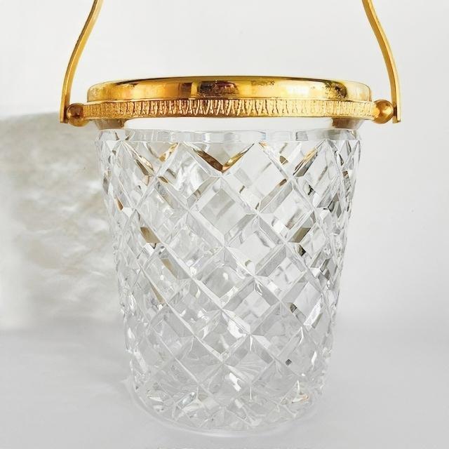 Crystal ice bucket with a 24-karat gold-plated handle and decorative rim. Origin: circa 1950s, Belgium. Probably...